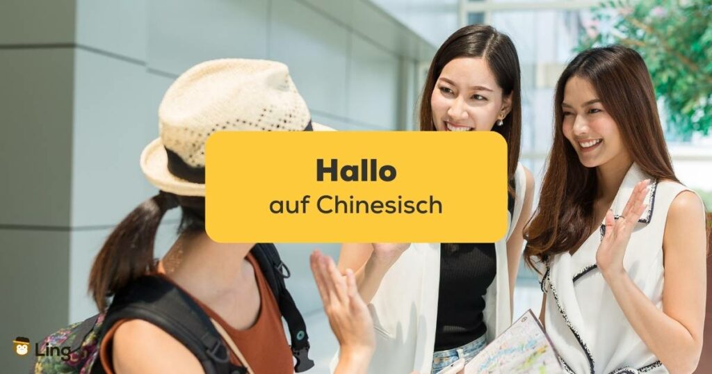 Drei asiatische Freundinnen begrüßen sich mit Hallo auf Chinesisch
