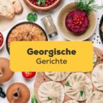 Tisch mit einer bunten Vielfalt georgische Gerichte, die man unbedingt probieren sollte